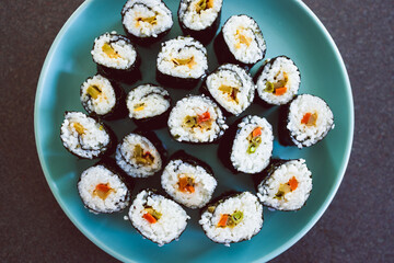 plant-based food, homemade vegan sushi with stir fried vegetable filling