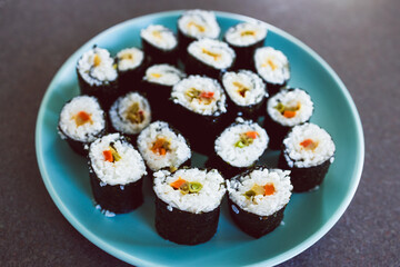 plant-based food, homemade vegan sushi with stir fried vegetable filling