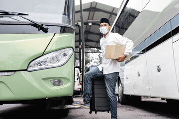 male muslim travel by public bus during pandemic wearing mask
