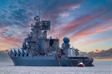 A warship under a beautiful sky. Warship, naval forces. Military control of the sea. Protection of water state borders. Military fleet. - obrazy, fototapety, plakaty