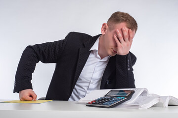 Problems in business. A man is worried about the losses of his company. A businessman holds his...