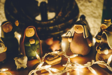 Nativity Scene on a wooden table with xmas lights