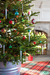 Fototapeta na wymiar Low angle closeup of fir tree decorated with vintage glass ornaments