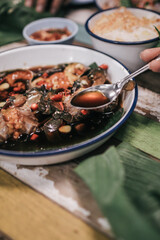 Korean food traditional fresh crab raw soy sauce marinated or Ganjang gejang in Korean name served in white plate on wooden table.