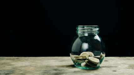 
savings in quarantine times in a glass with coins