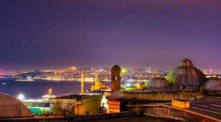 Fototapeta na wymiar Panoramic view of Istanbul city and Bosphorus at night time from Suleymaniye district. Turkey.