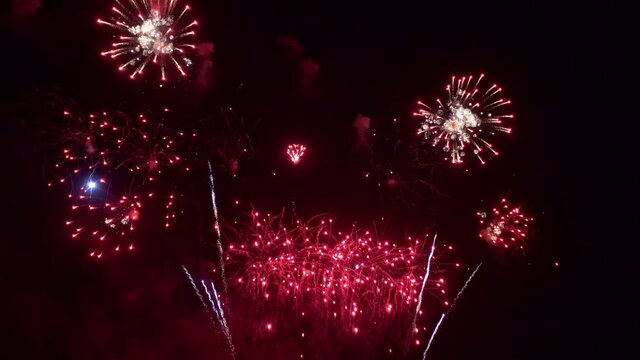 Red Firework Explosions in Night Sky, Frame Fill Static.