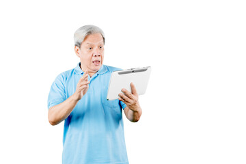 Shocked old man reading a news on his tablet
