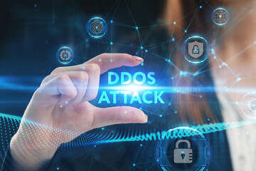 Business, Technology, Internet and network concept. Young businessman working on a virtual screen of the future and sees the inscription: Ddos attack