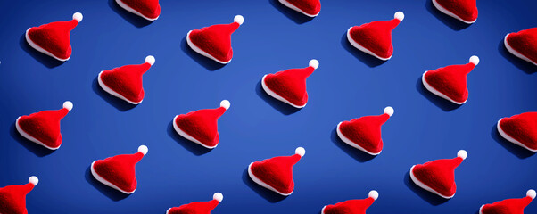 Pattern of small santa hats - overhead view flat lay