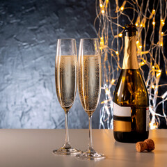 Happy New Year composition with champagne and illumination.