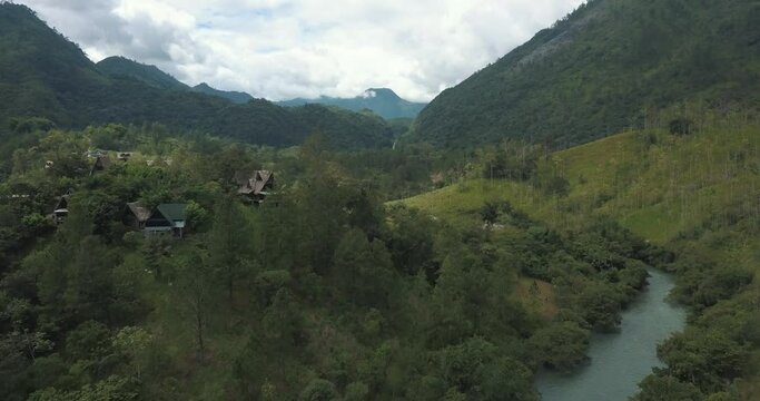 Drone aerial rising shot of tropical valley, mountains and river Cahabon in Guatemala