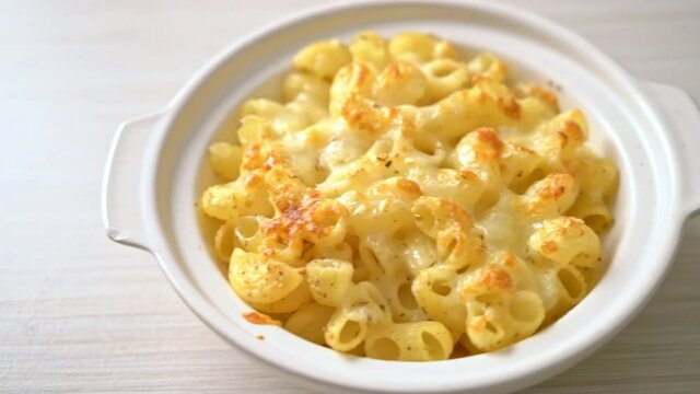 mac and cheese, macaroni pasta in cheesy sauce - American style