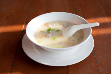 Rice porridge with pork chops and seasoning in the Morning