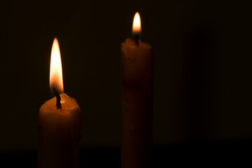 Fototapeta na wymiar Light a candle in the dark