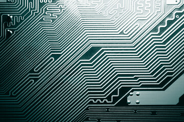 Blue electronic mother board circuit close up macro background.