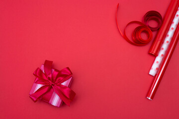 various accessories for gift wrapping in red shades
