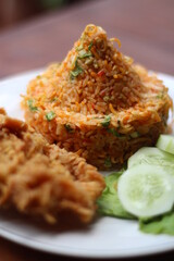 Indonesia Traditional Spicy Fried Rice with fried chicken