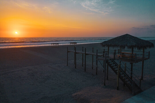 Silhouette of Typical Lifeguard tower station at sunset, Baywatch tower on the beach.