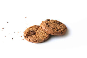 Chocolate chip cookies with crumbs isolated on white background