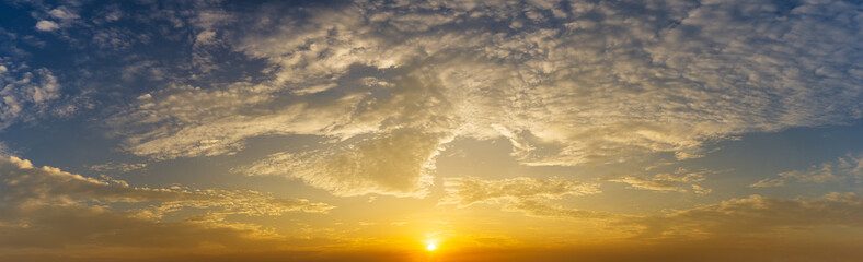 Naklejka na ściany i meble Dramatic sunrise and cloud sky nature panorama background