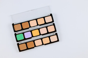 Eyeshadows palette of multicolor cosmetic make up on a isolated white background