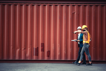Businessmen, executives and engineers wear medical face masks. While inspecting industrial plants...