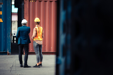 Businessmen, executives and engineers wear medical face masks. While inspecting industrial plants and warehouses for international shipping businesses Concepts of import and export