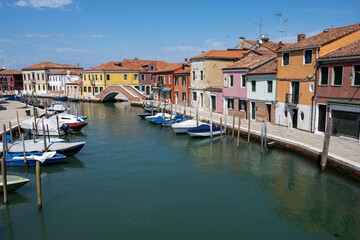 Fototapeta na wymiar Colorful houses at a canal in Murano, Italy