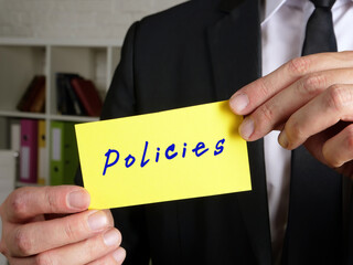 Business concept about Policies  with inscription on the sheet.