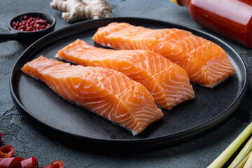 Fish patties ingredients with salmon and lemongrass, on  grey background