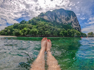 Blurred Woman feet at the sea
