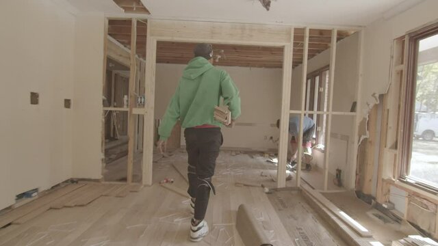 Worker walks through construction site