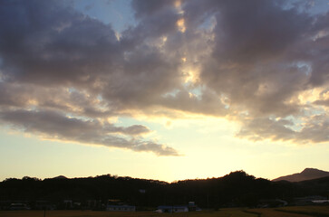 Fototapeta na wymiar Sunset sky and mountain silhouette.