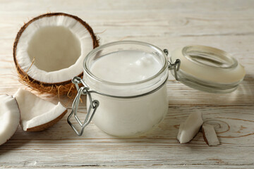 Fresh coconut and coconut milk on wooden background