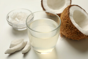 Fresh coconut and coconut milk on white background