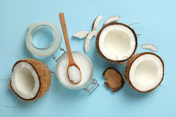 Fresh coconut and coconut milk on blue background