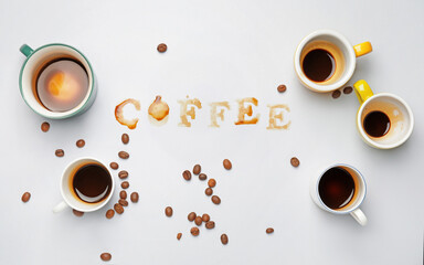 Word COFFEE made of coffee  stains on light background