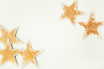 Fototapeta na wymiar Gold stars on the white background. Christmas star. Copy space for text