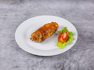 Cutlet with tomatoes and herbs