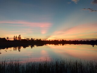 Obraz premium sunset over the river