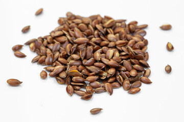 flax seeds heap on a white background