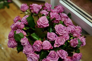 Bouquets of various flowers on counter. Fresh beautiful flowers in florist shop.