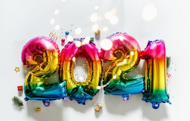 Rainbow colored Foil balloons in the form of numbers 2021. New year celebration
