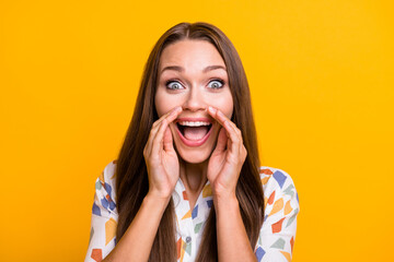 Photo of young attractive woman hands near mouth say tell news yell announcement isolated over yellow color background