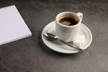 Coffee cup with a notebook