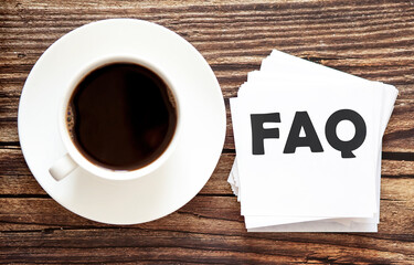 Word writing text FAQ . Business concept for Urgent Move.Text in stickers with a cap of coffee