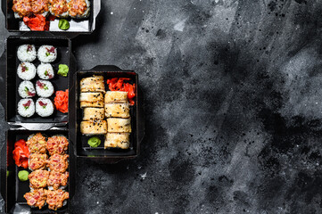 Japanese food concept. Catering, various kinds of sushi rolls set.  Black background. Top view. Copy space