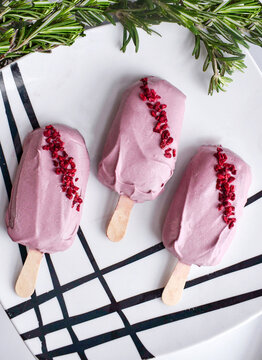 Vegan cake pops eskimo. Pink chocolate lactose free icing. Healthy dessert holiday treat sweet. Party eating popsicle top view photo