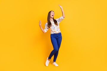 Fototapeta na wymiar Photo portrait full body view of dancing carefree girl isolated on vivid yellow colored background